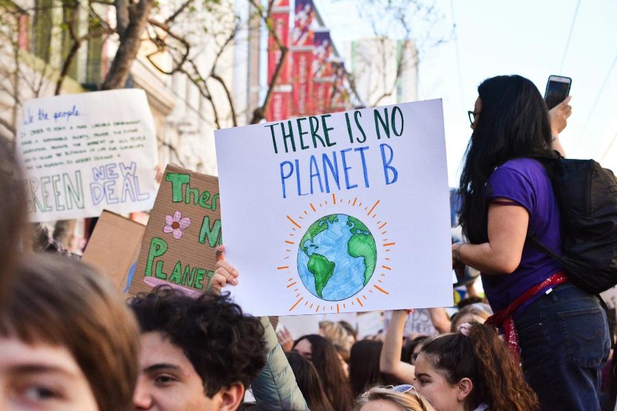 10 Climate issues for the Labour government to tackle. Image shows protest placard of al illustration of the earth saying 'there is no planet B'