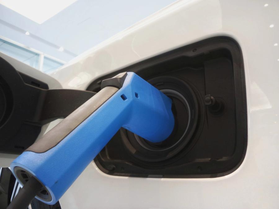 Electric vehicle charger plugged in to car