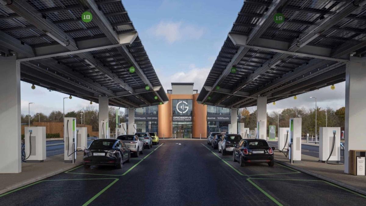 CGI rendering of a Gridserve electric forecourt with cars charging