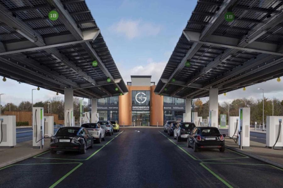 CGI rendering of a Gridserve electric forecourt with cars charging