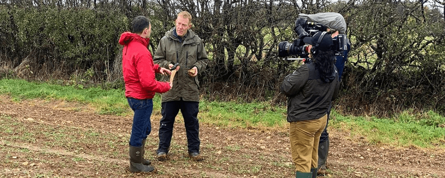 Reporters speaking with the UNDO representative in the field.