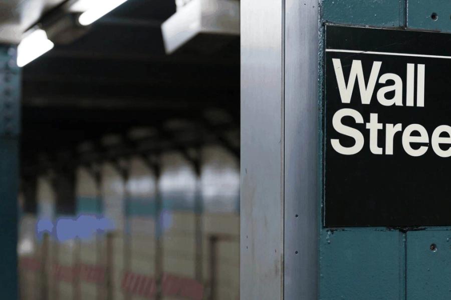 Subway sign reads "Wall Street".