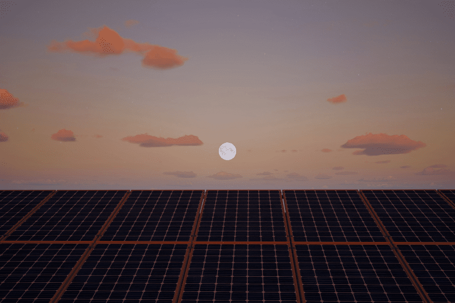 Moon at dusk over solar panels