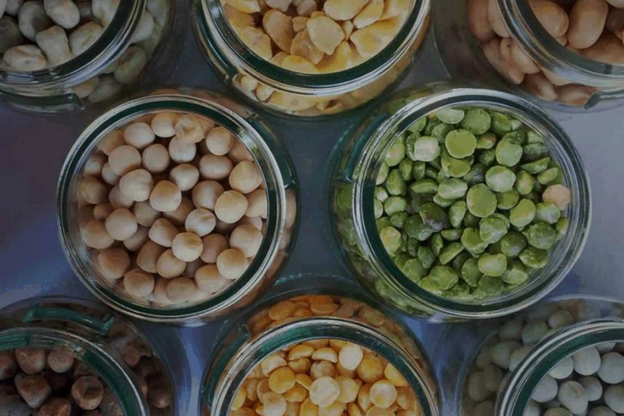 Top down photo of jars containing pulses.