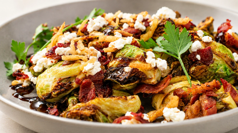 Crispy roasted Brussels sprouts with goat cheese, crispy bacon and a balsamic glaze