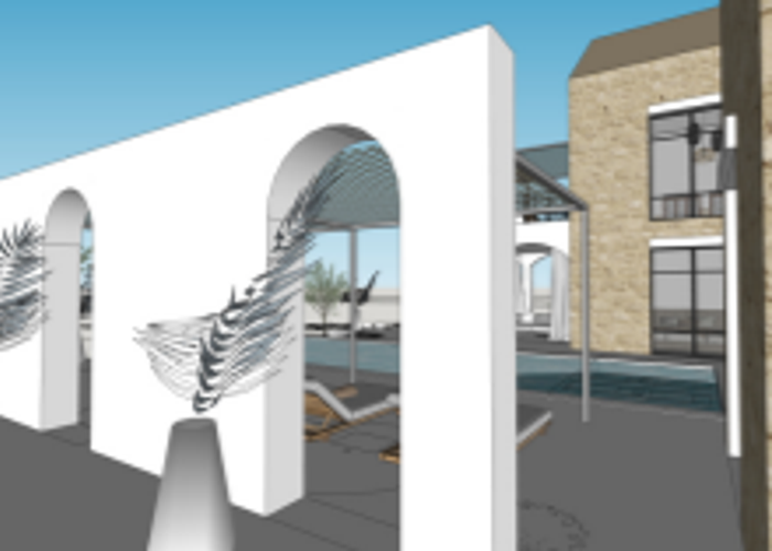 Feature wall with arches to close courtyard