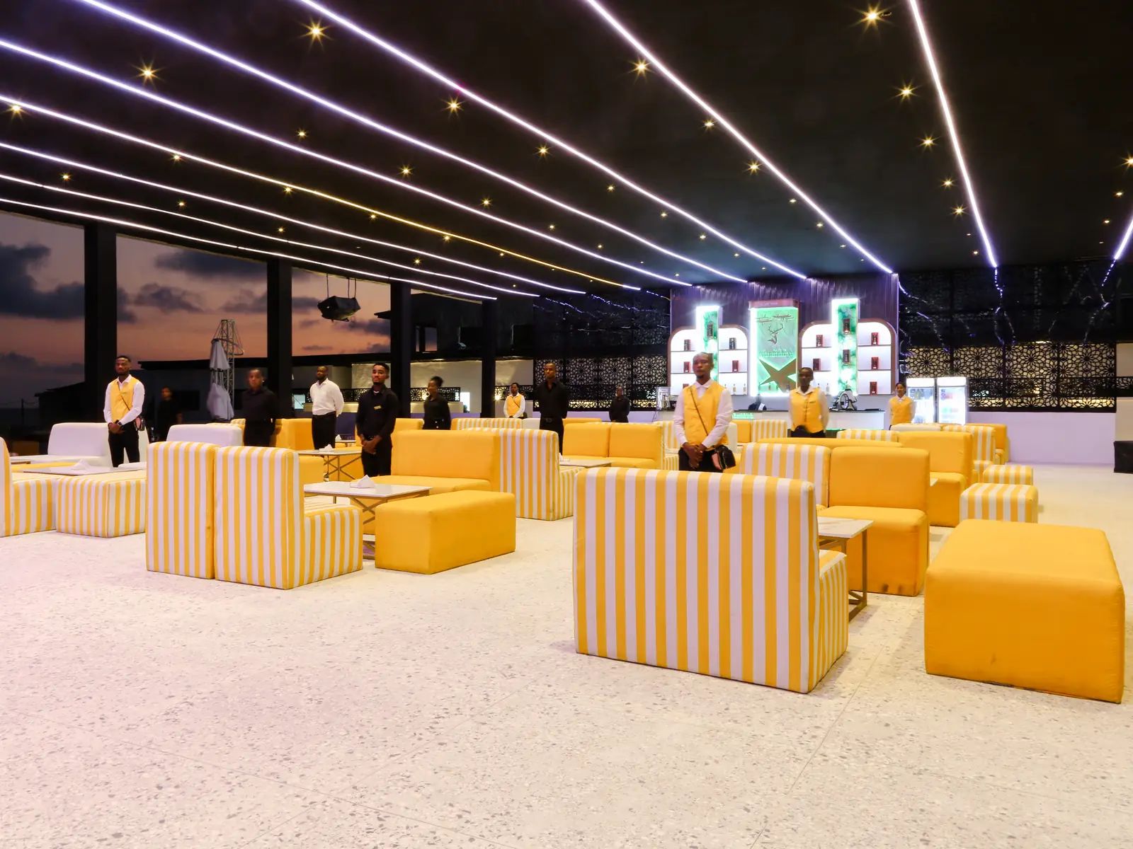 Lounge seating at dusk under string lights