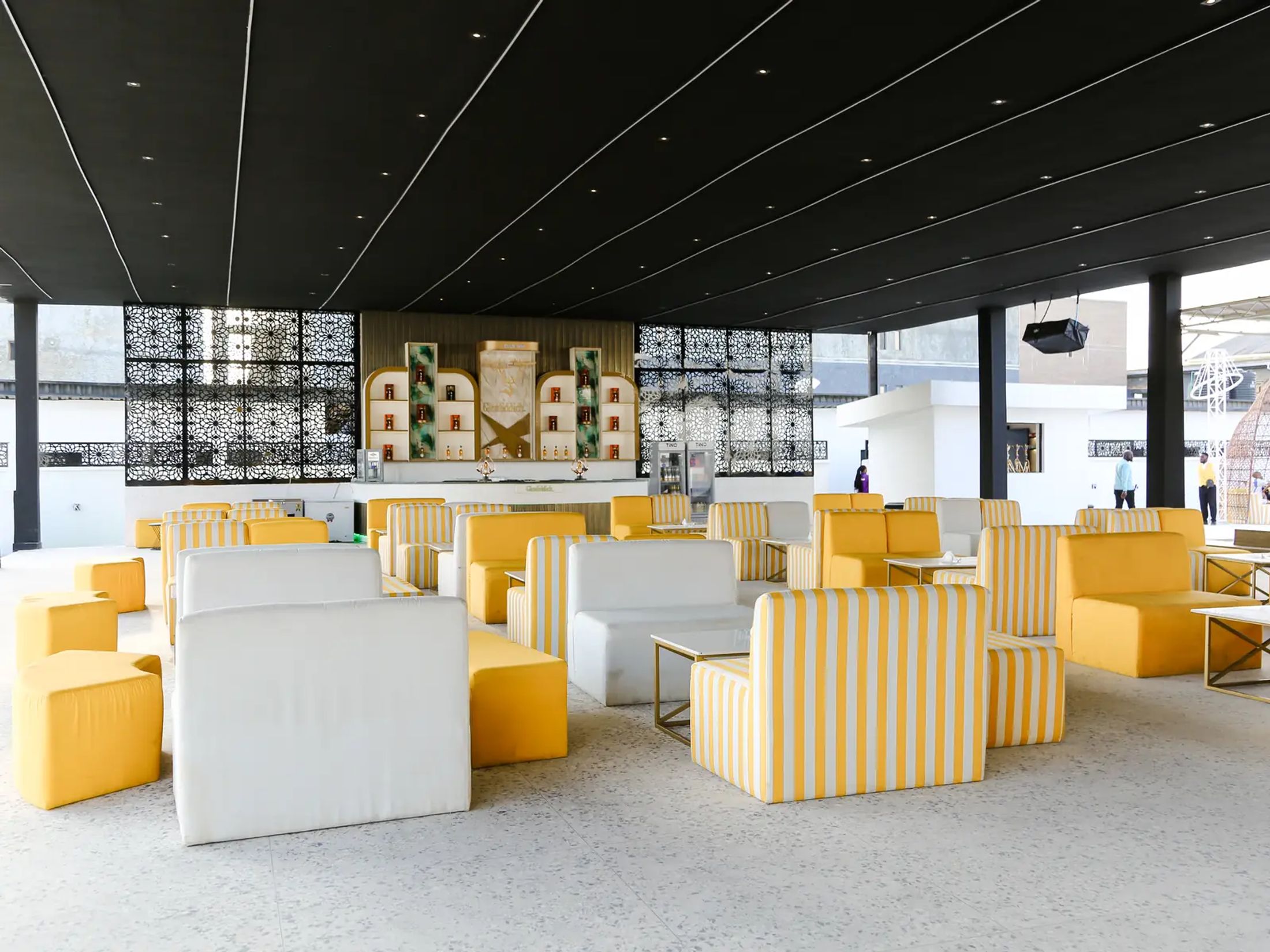Striped seating laid out on the sand