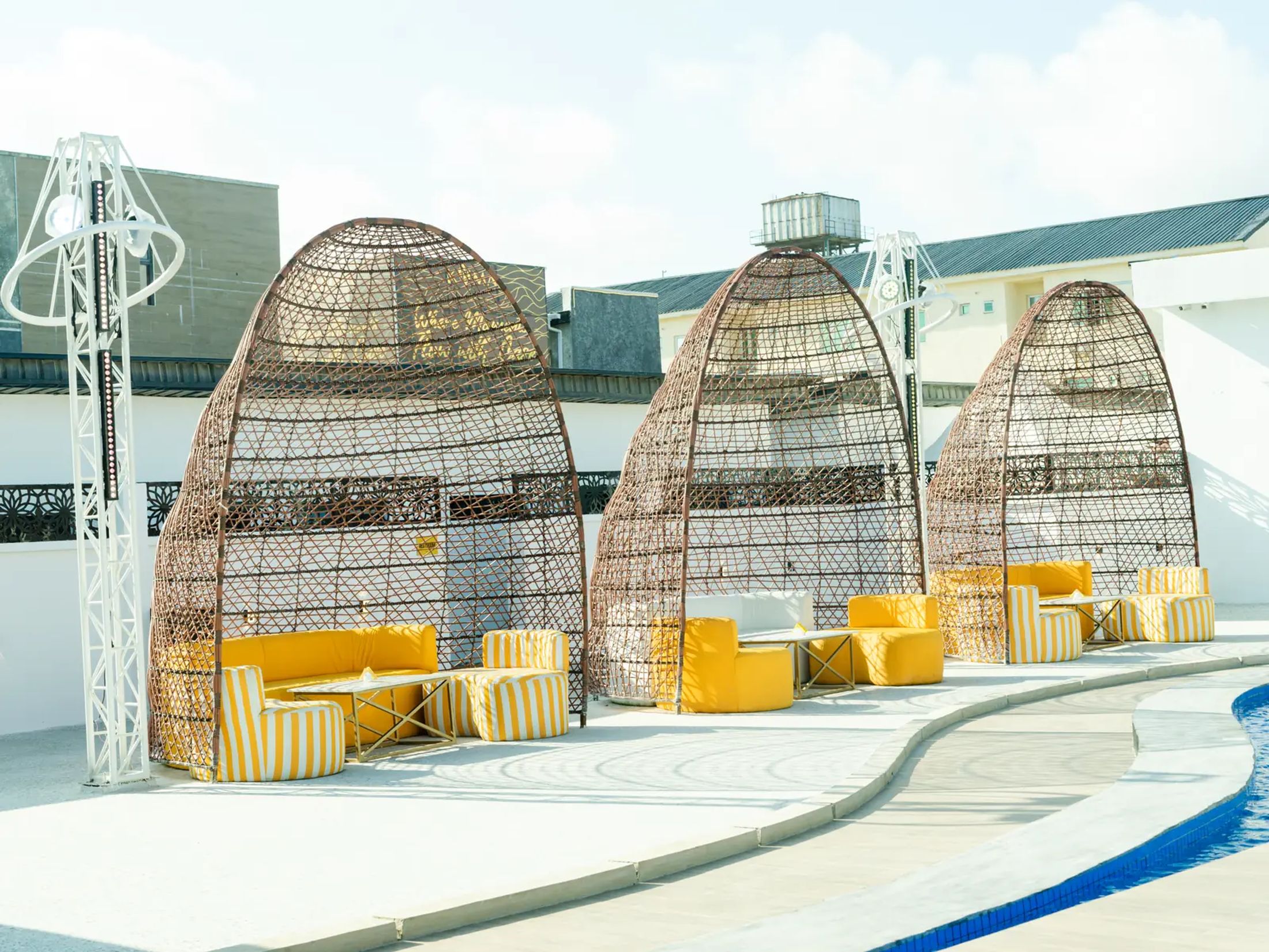 A row of cabana domes along the pool