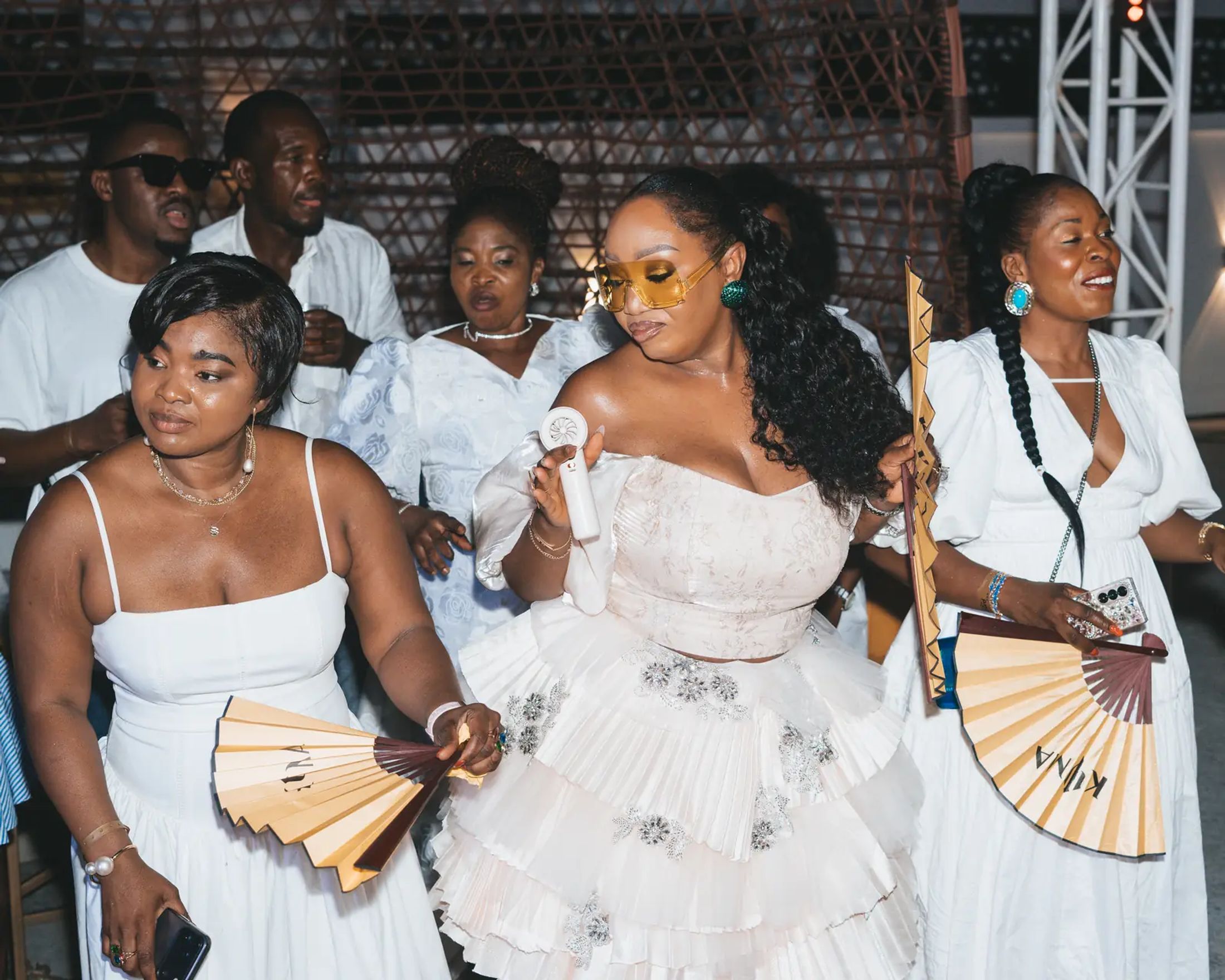 Guests in white with KYMA fans