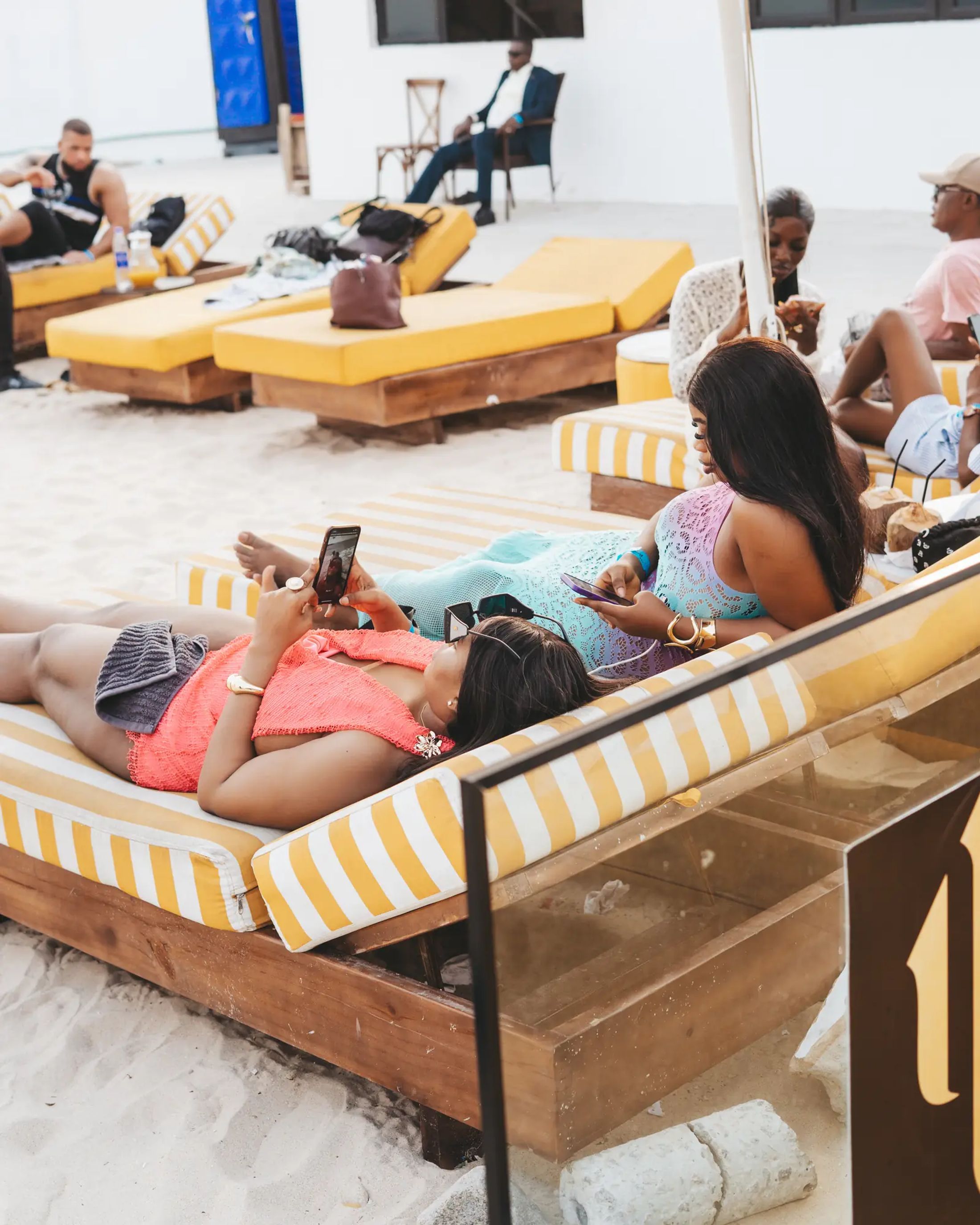 Guests on loungers by the water