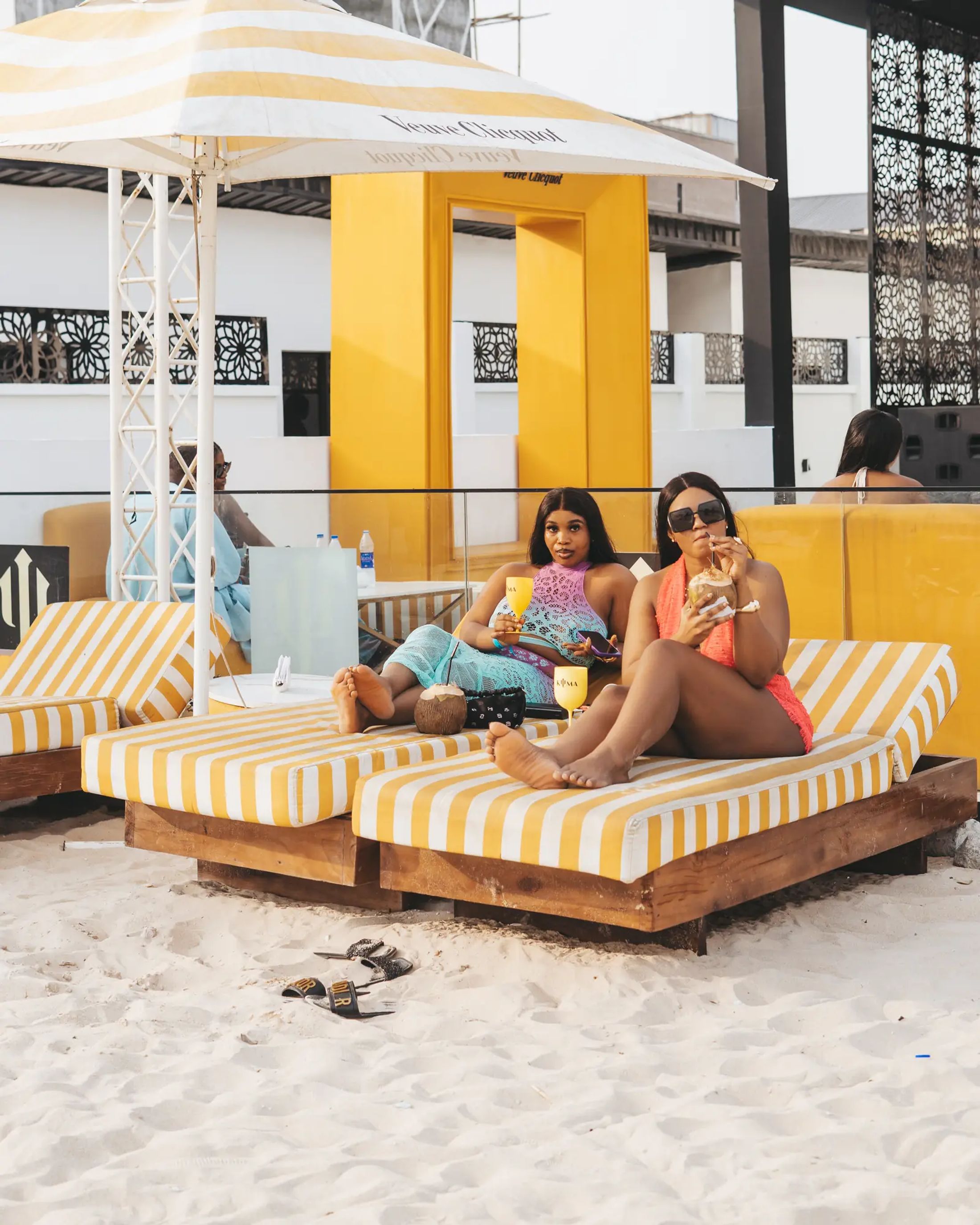 Guests in the shade of a cabana
