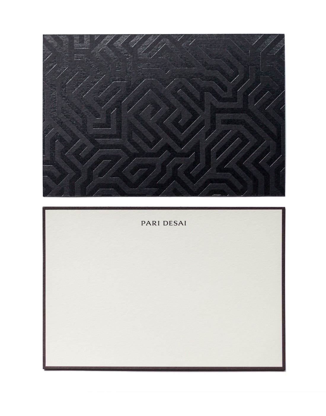 Printed stationery note card reading "Pari Desai" on the front, with an embossed graphic pattern on the reverse of the card