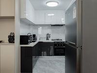 Modern Sophistication: Stylish 2-Bedroom Executive Sanctuary with DSQ - Image 11