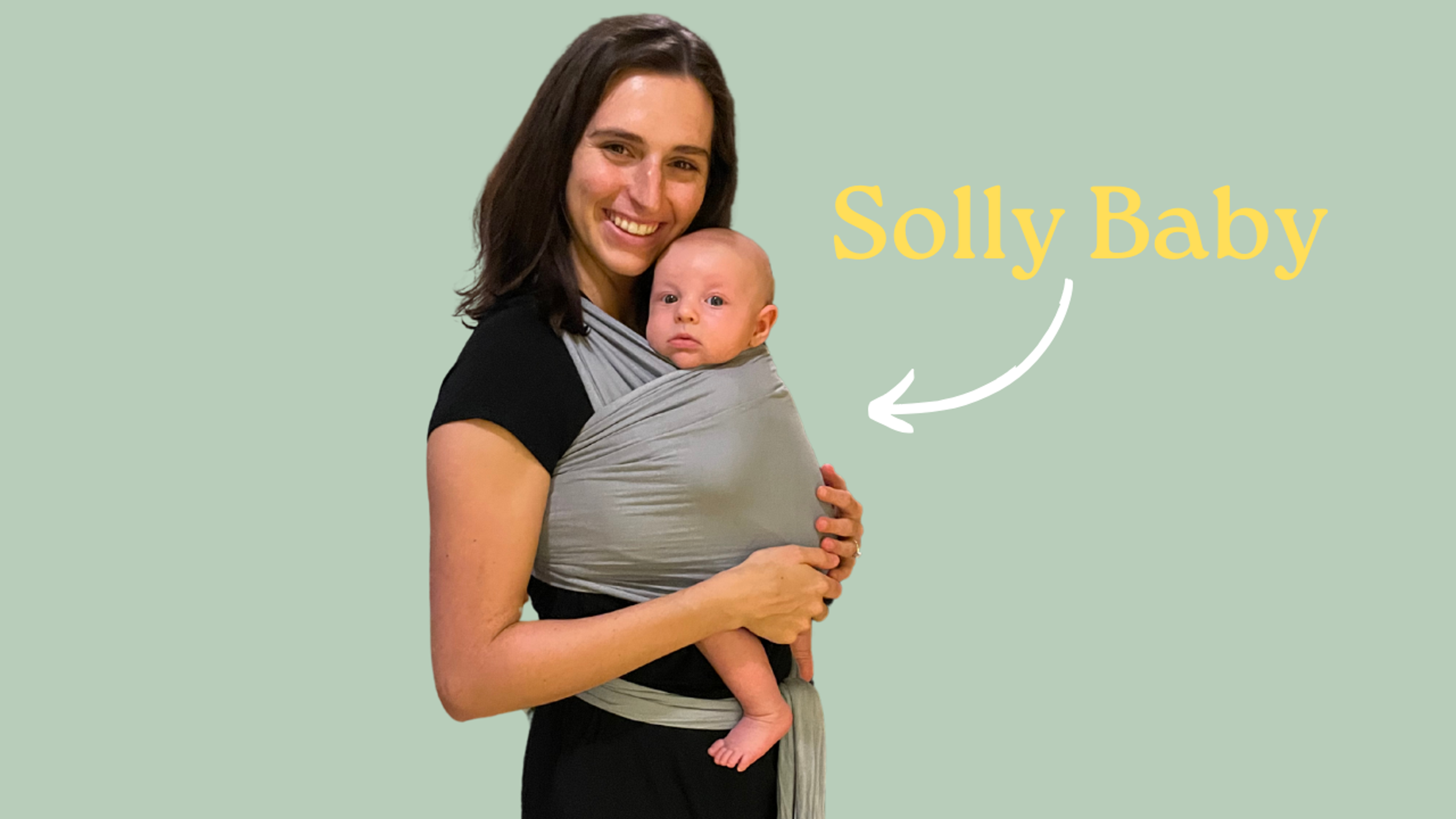 A women holds her baby wrapped in the Solly Baby wrap.