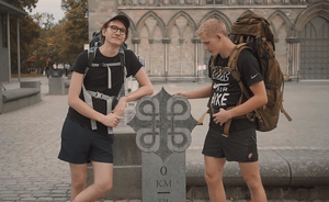 Two people outside of Nidaros Cathedral