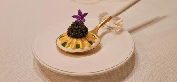 Appetizer on a golden spoon at Speilsalen