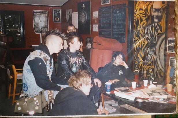 A group of 5 punk-rockers chilling at the old UFFA.