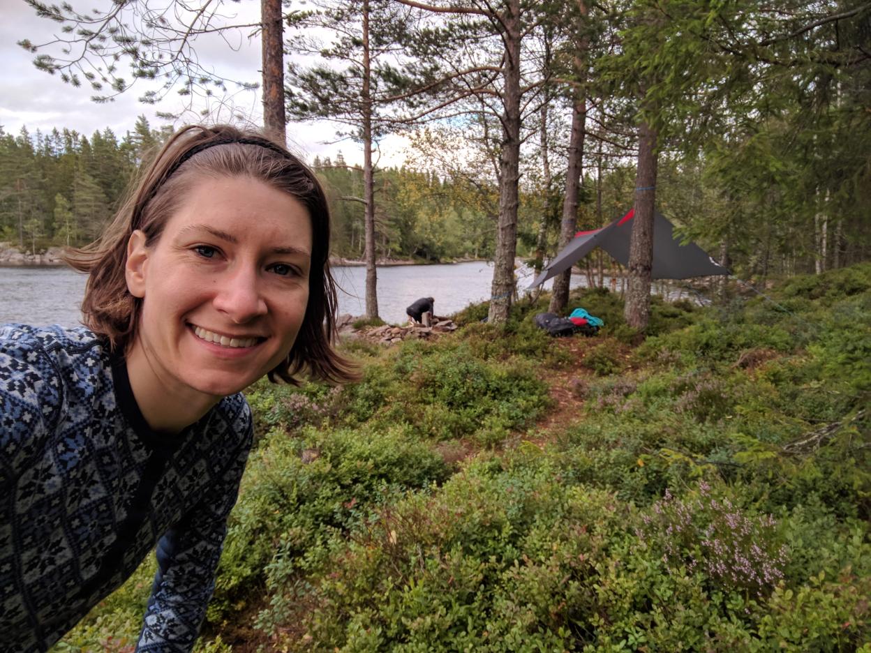 Tiffany out camping in the outskirts of Trondheim. Tent site in background.