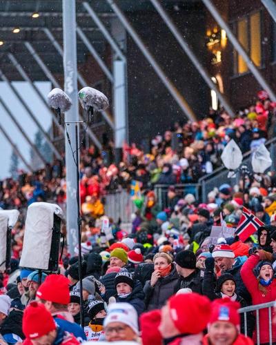 Spectators at Granåsen during pre-championship. Norwegian flags. Spectator ranks.