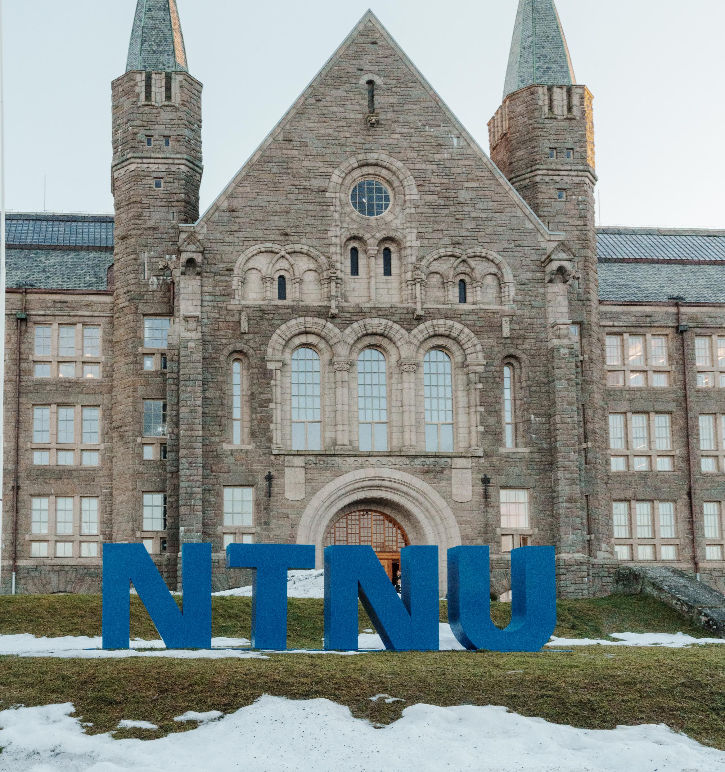 NTNU main building entrance with NTNU letters in front