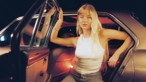 Astrid S getting out of a car - poster