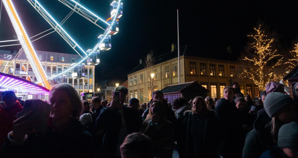 The people of Trondheim gather to witness the yearly lighting of the Christmas tree in the town square.