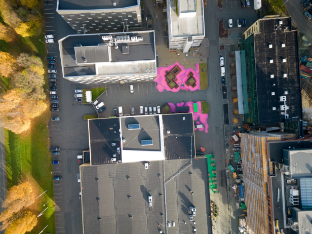 A view of sluppen from above. There is pink art on the ground, making it the Pink Square of Sluppen