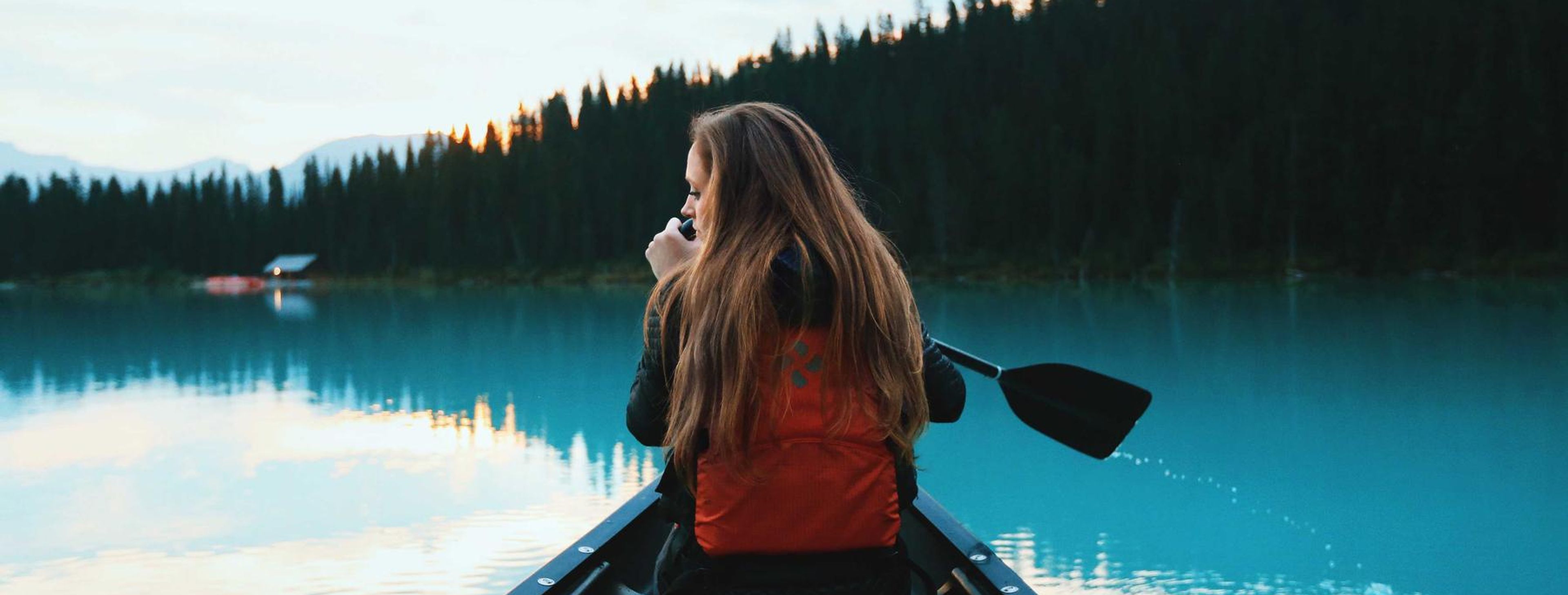 Transmission lines at sunset near a rural town