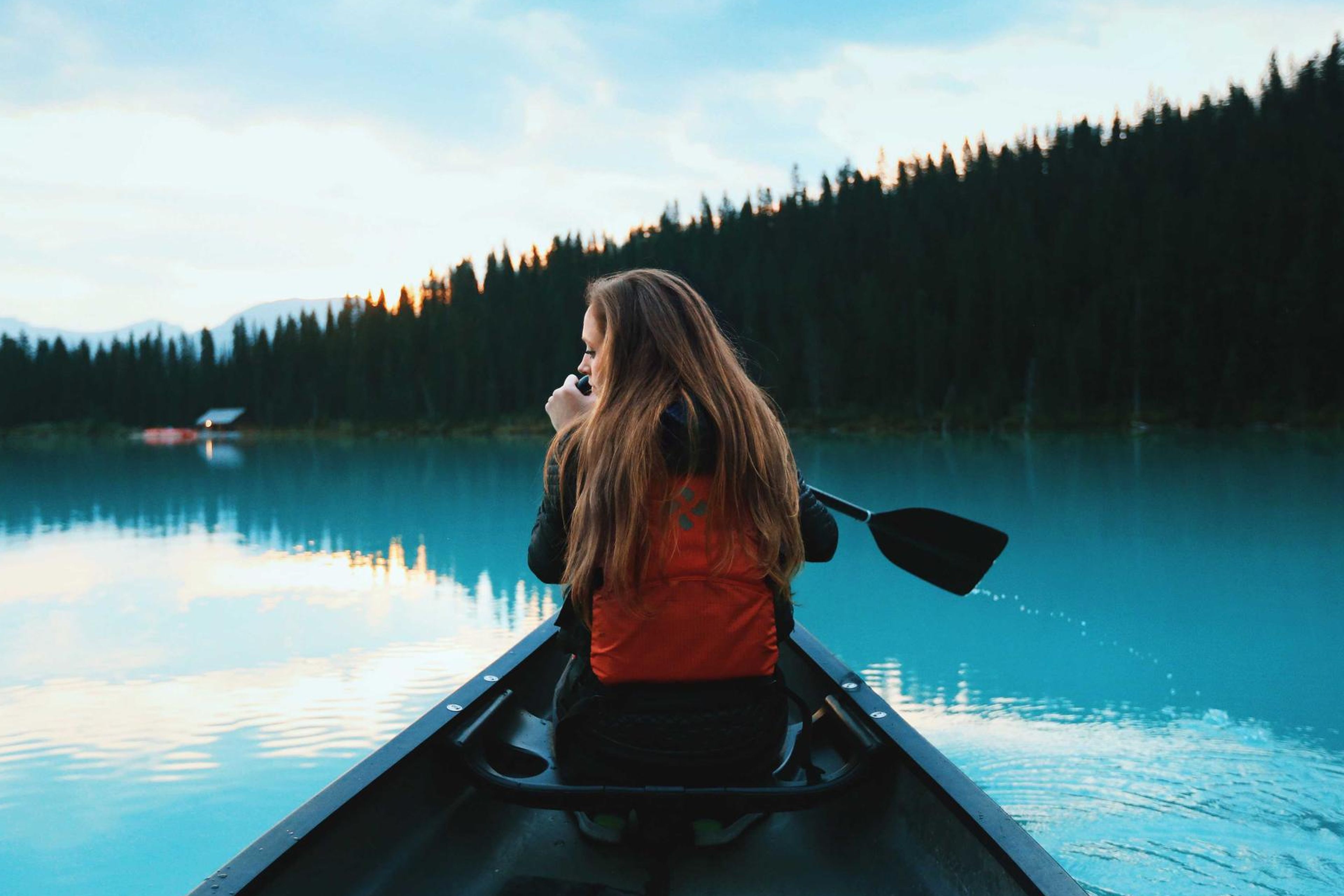 Transmission lines at sunset near a rural town