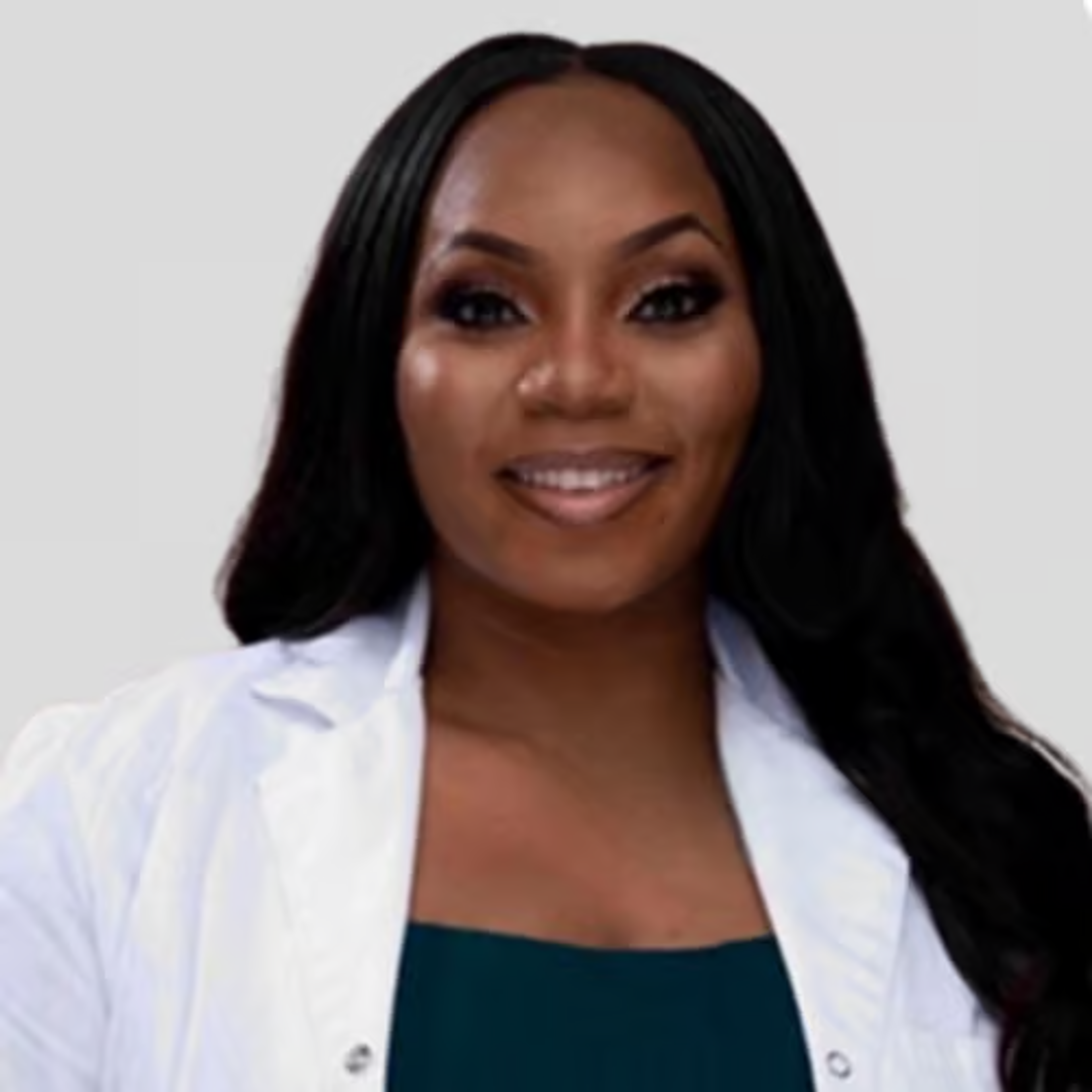 Merrissa Wesley-Chapman smiling, wearing a white coat