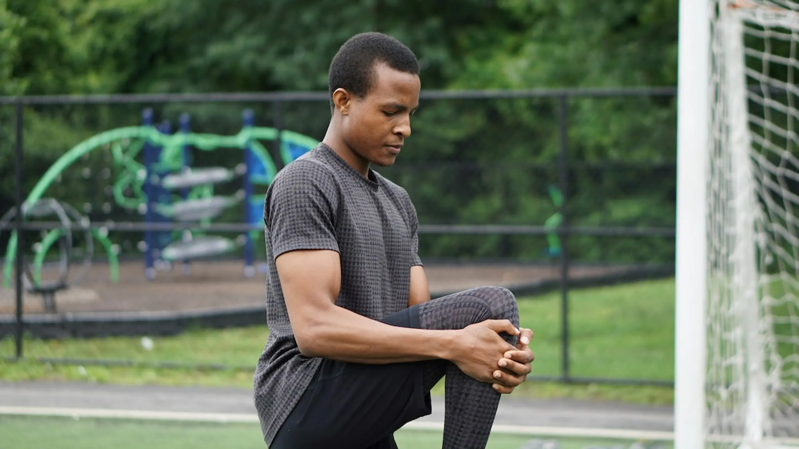 A man stretching in the park