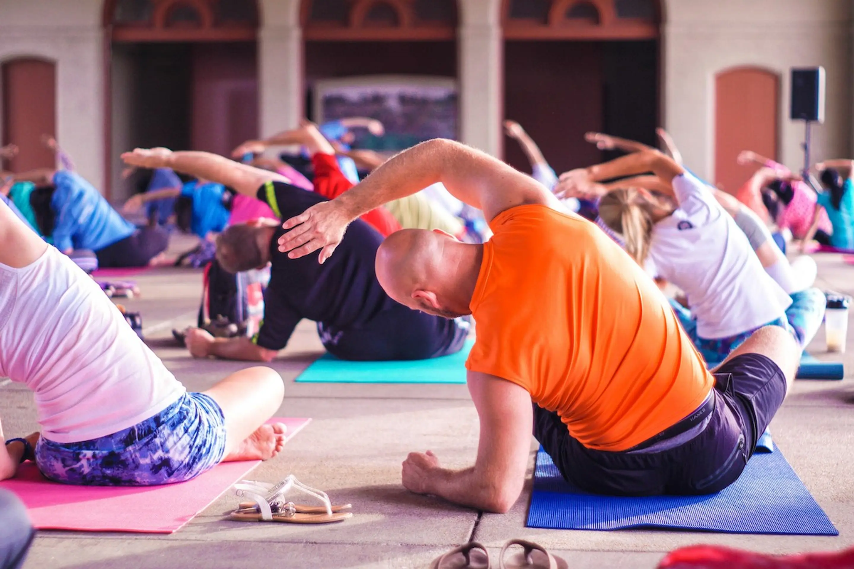 A man doing yoga in a group class