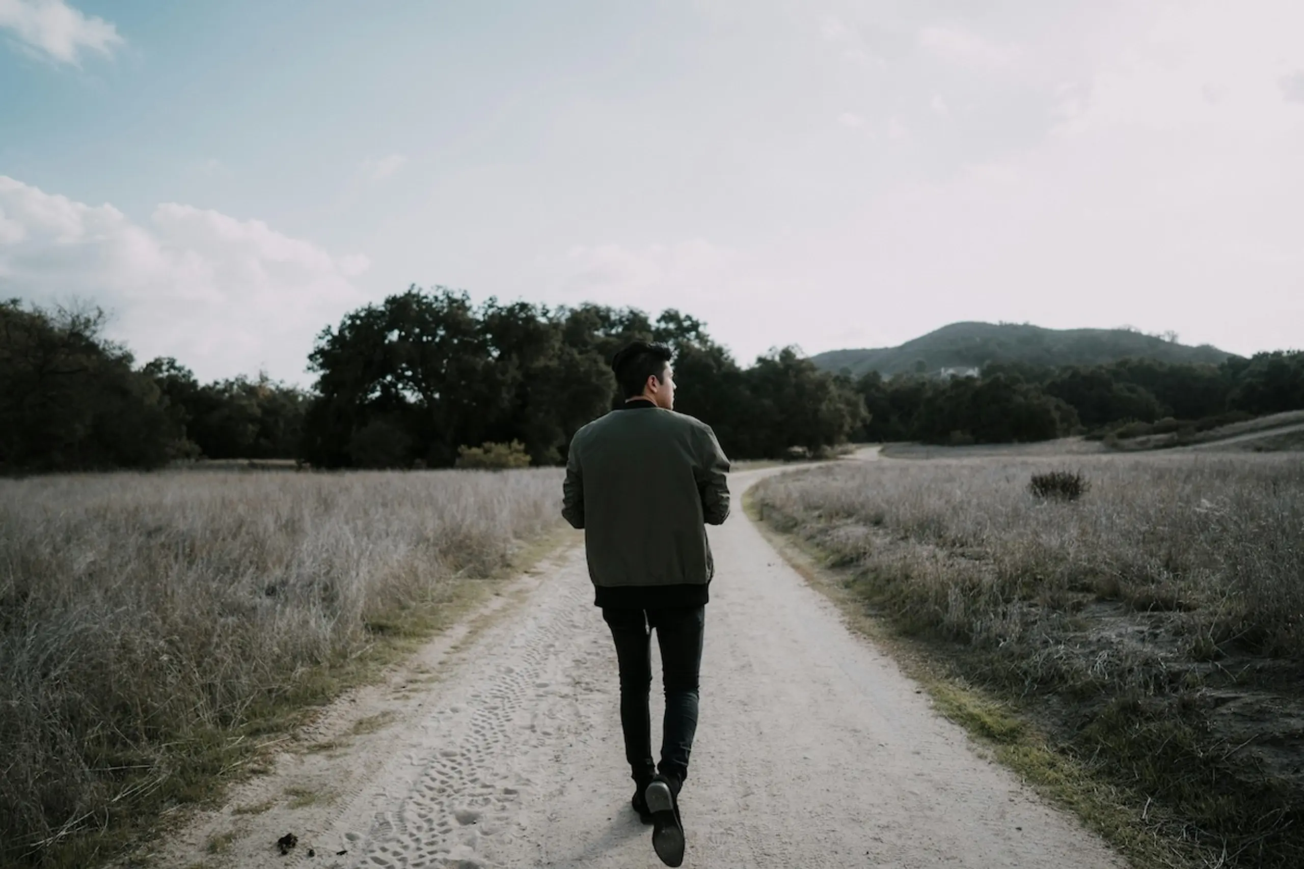 man walking on path