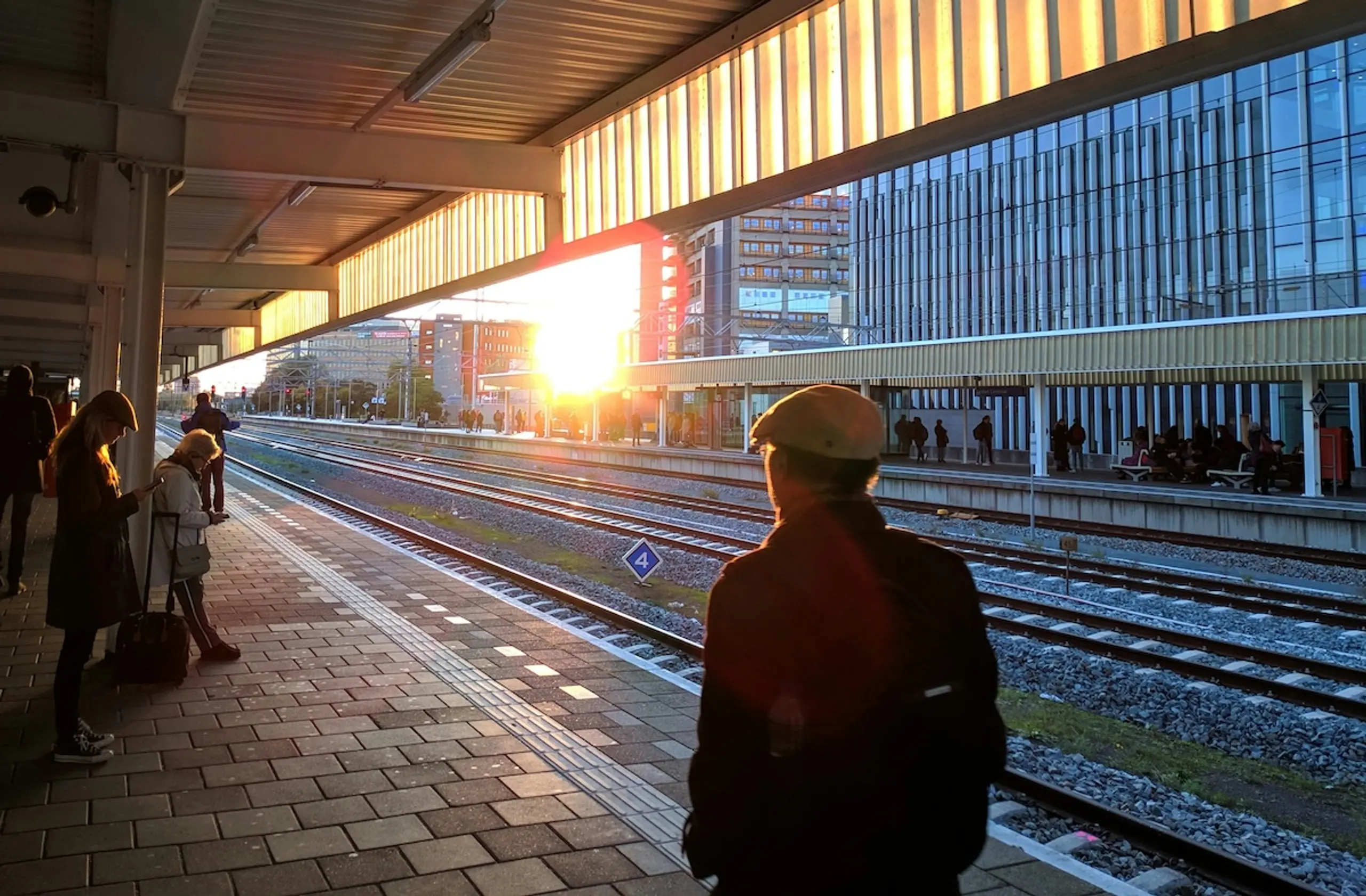 A man walking at train station in morning