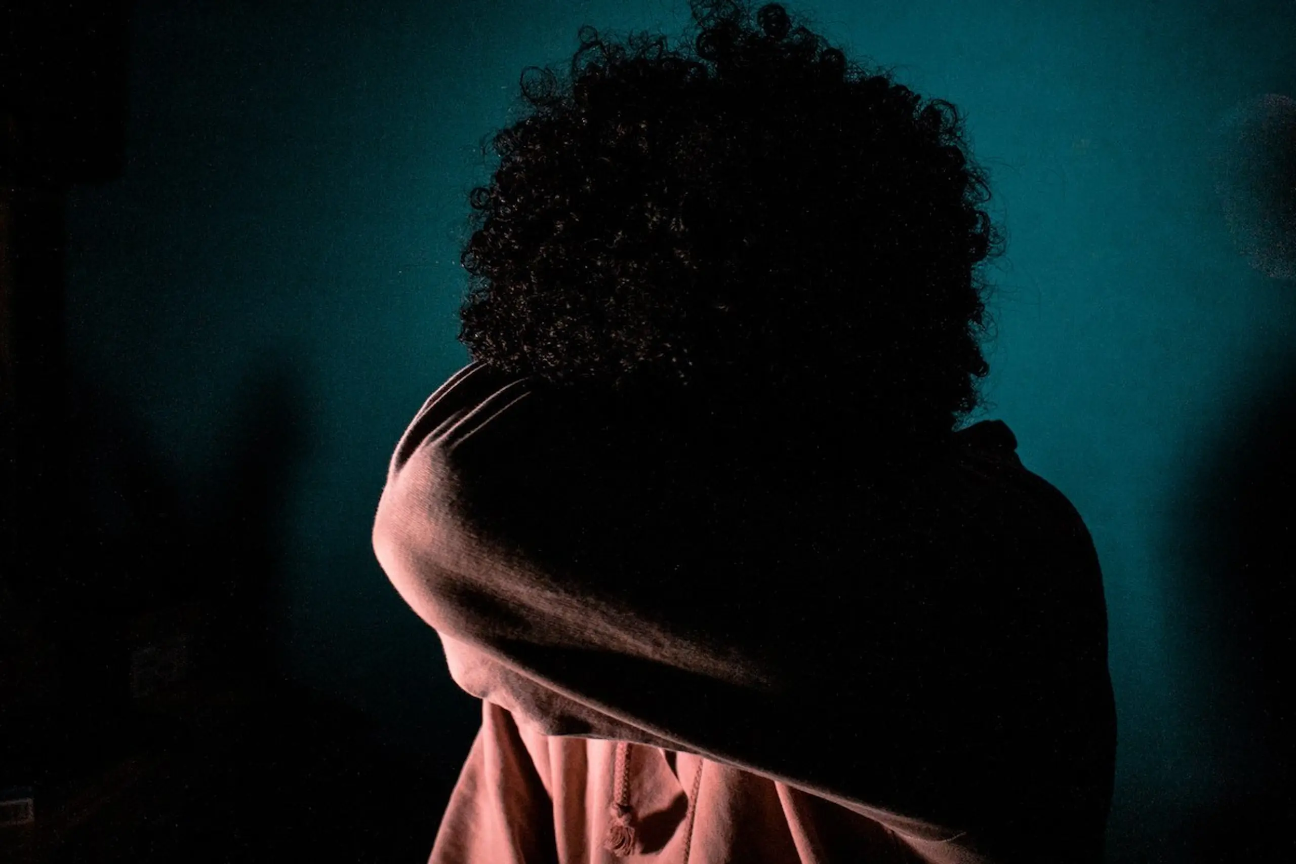 A person covering their face