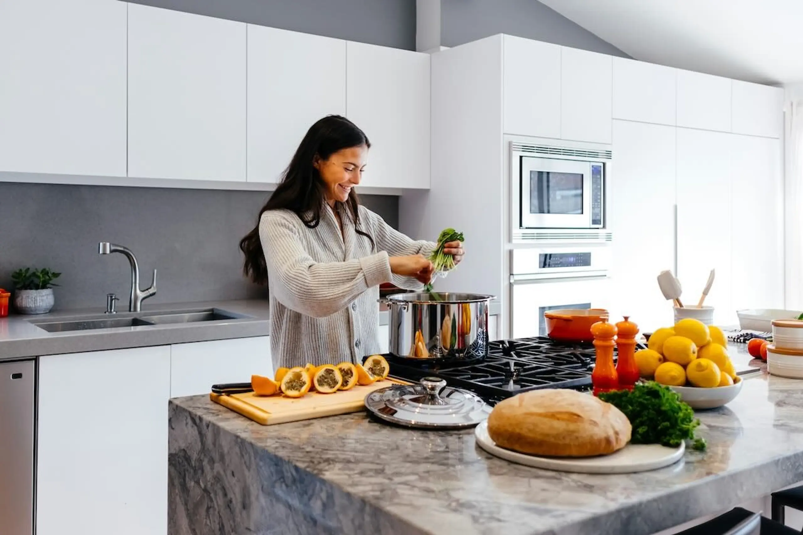 woman cooking vegetables in kitchen