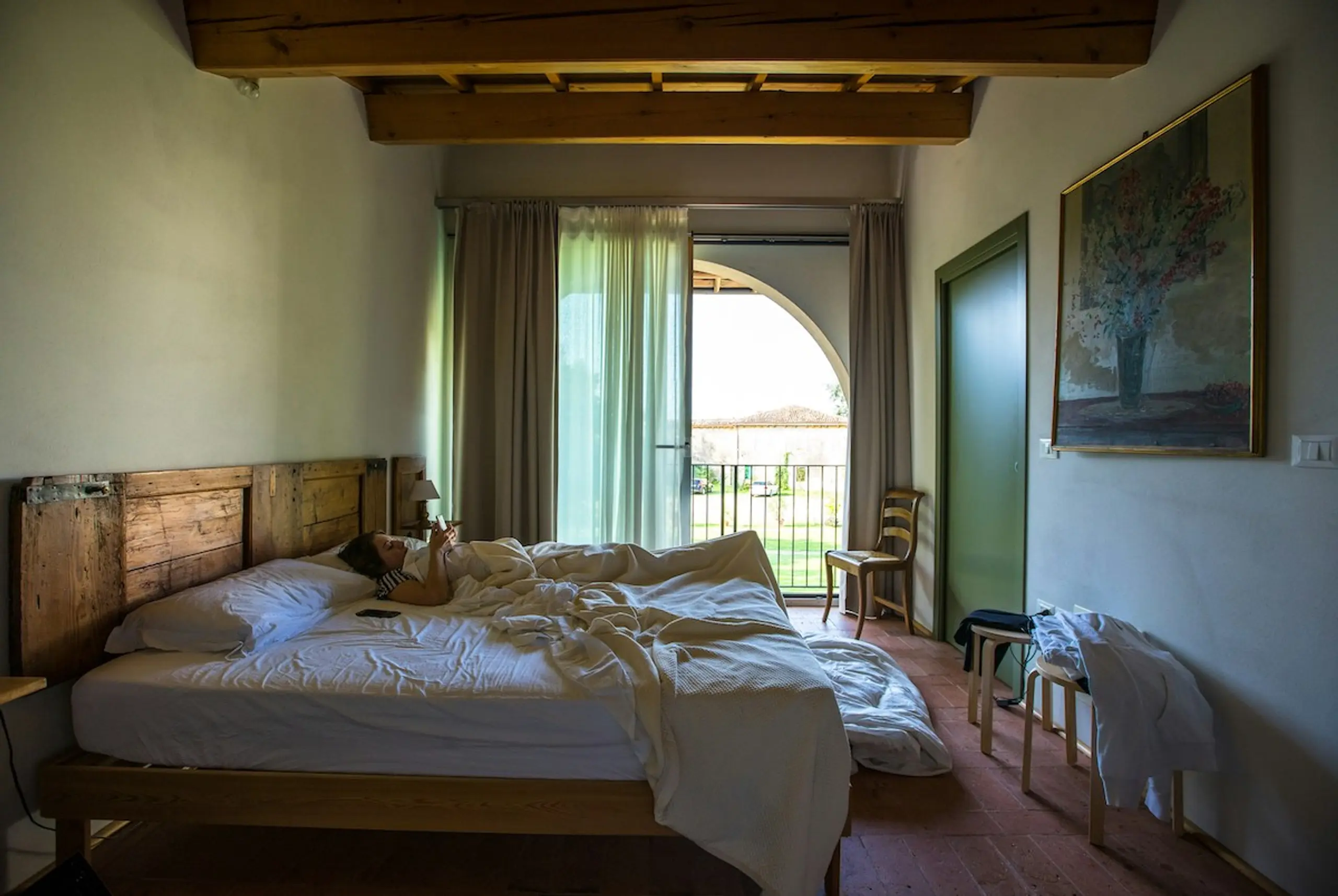 A woman on her phone in bed