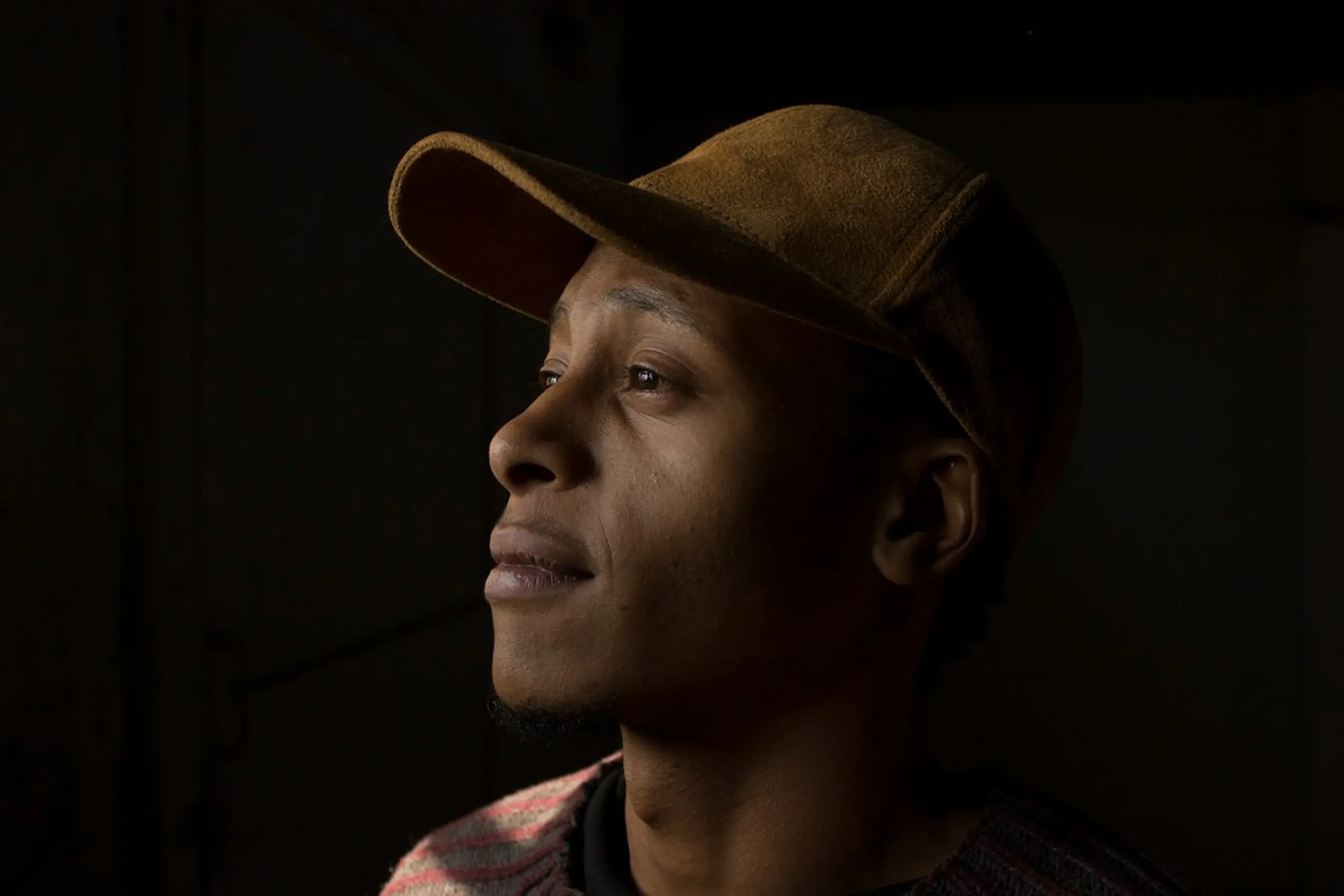 A concerned man looking to his right