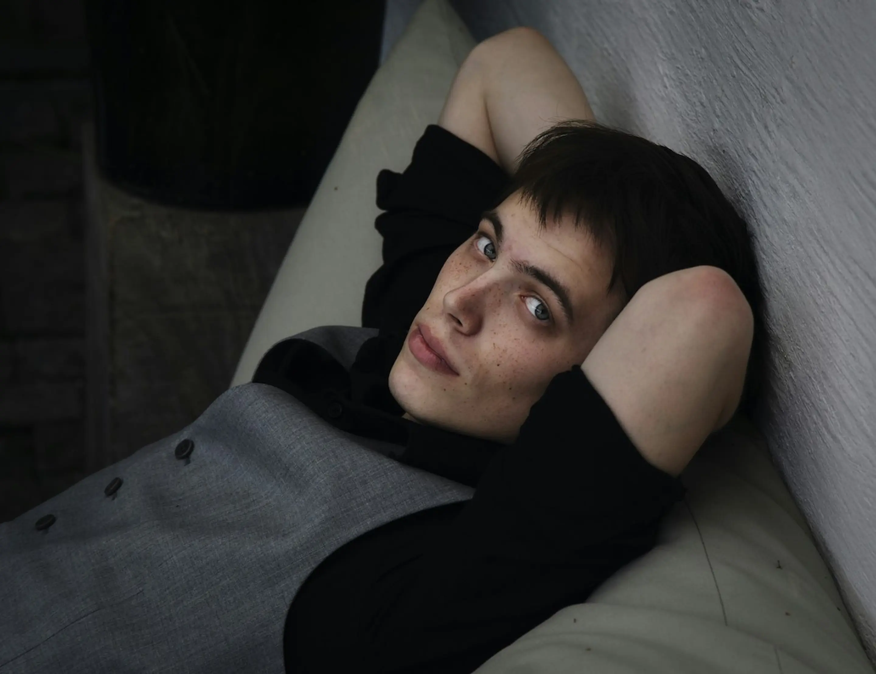 A man laying on the couch