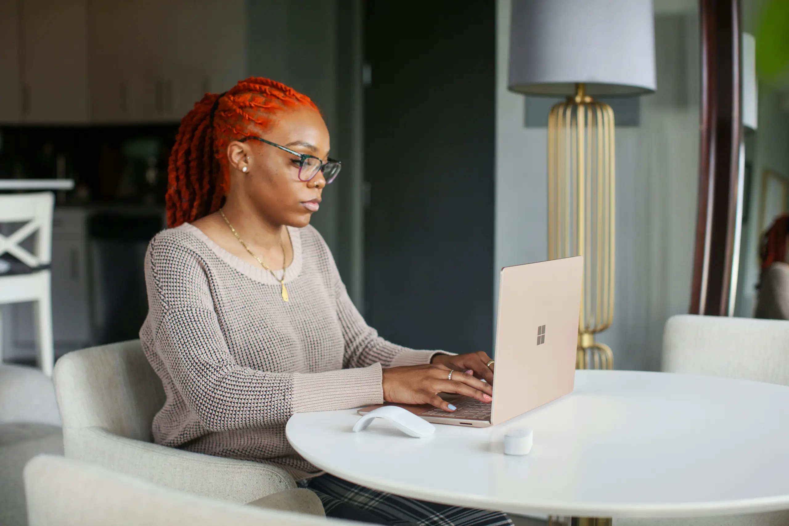 A person at home on her computer