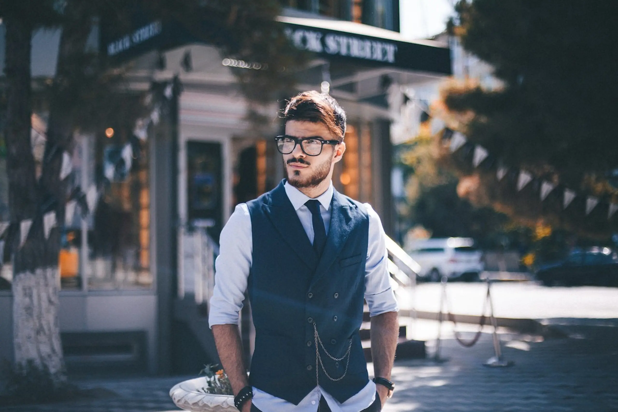 A pensive man walking outside