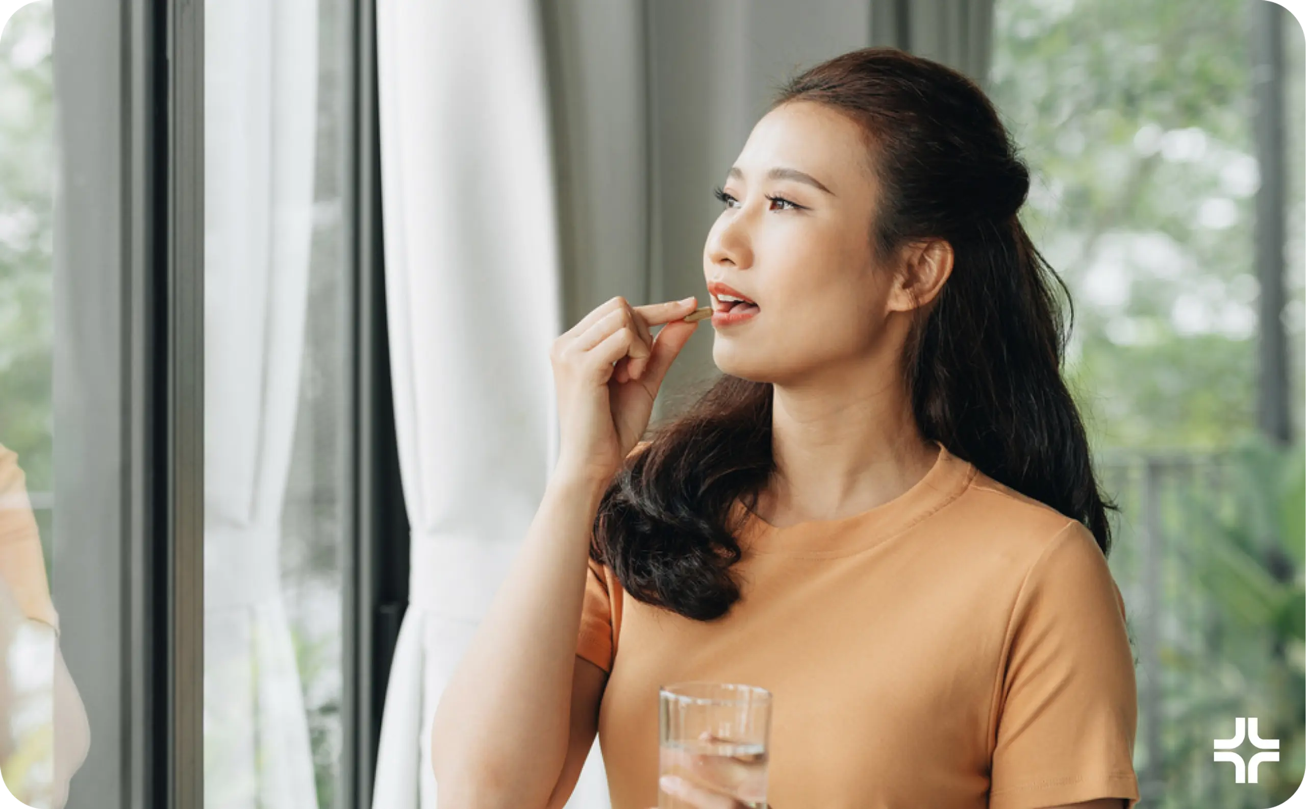 Woman taking medicine