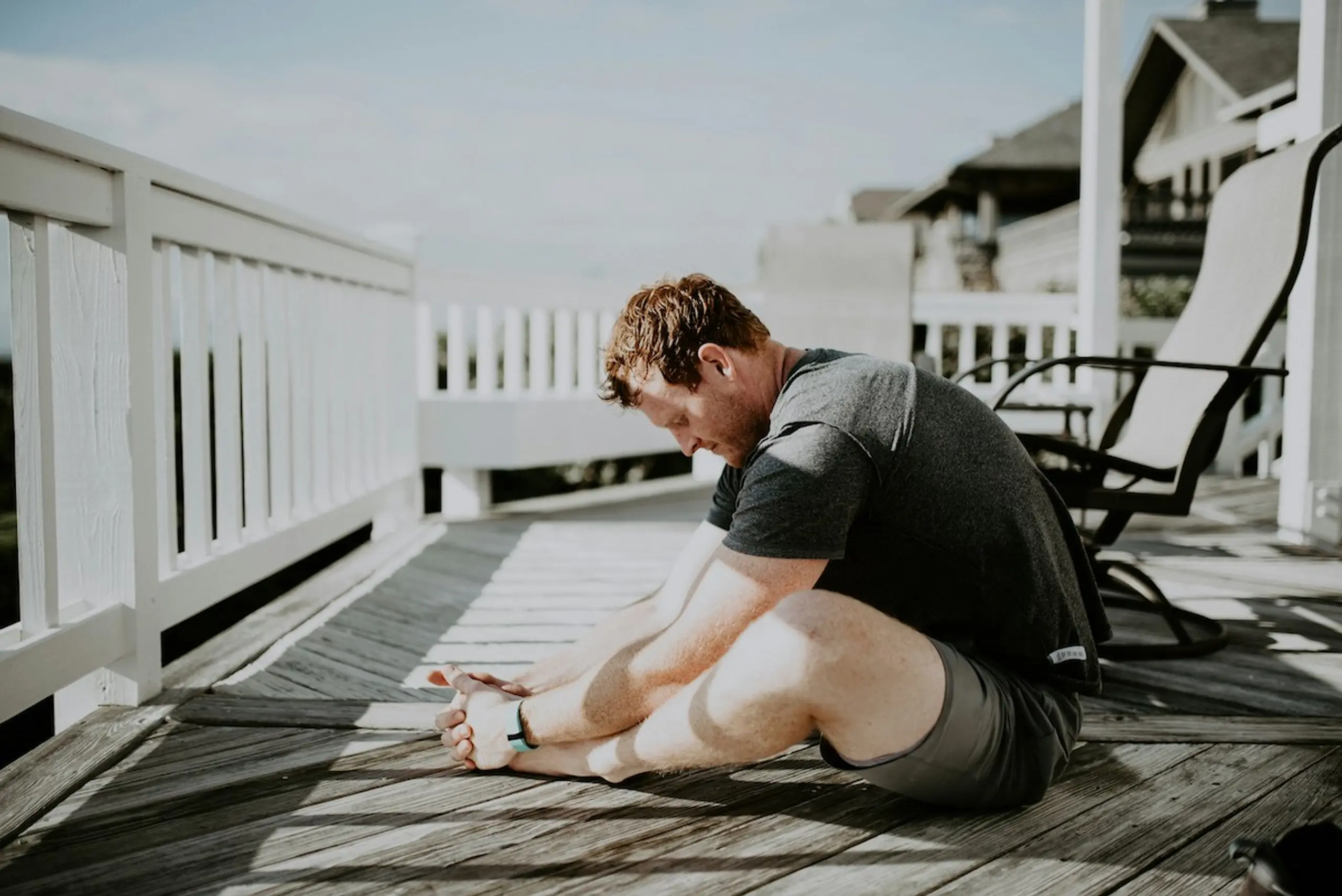 A man stretching outside