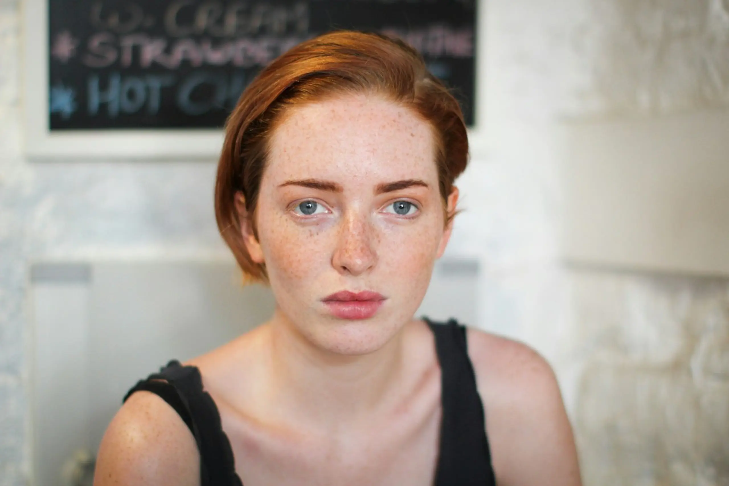 A concerned woman looking at the camera