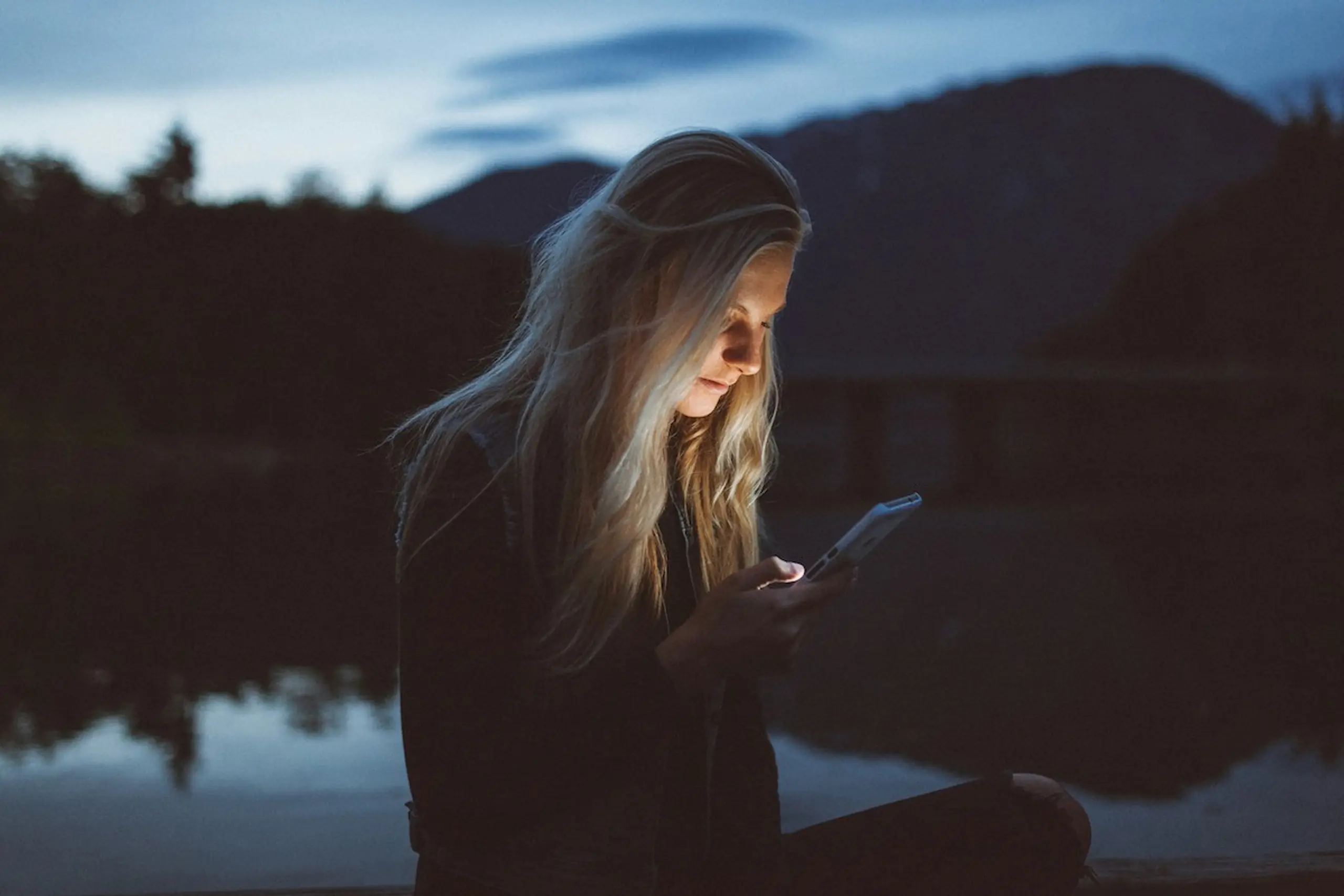 A woman on her phone outside