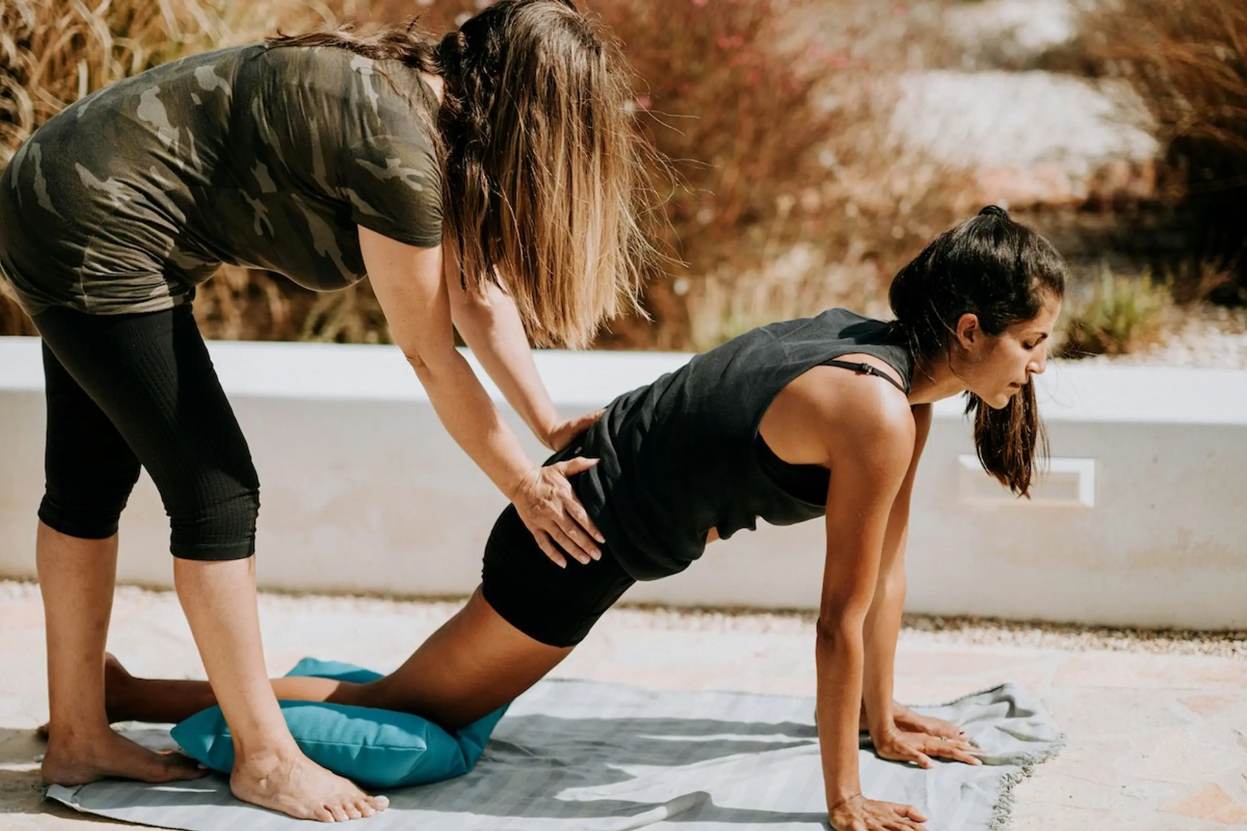 A woman getting help with exercises to help with back pain