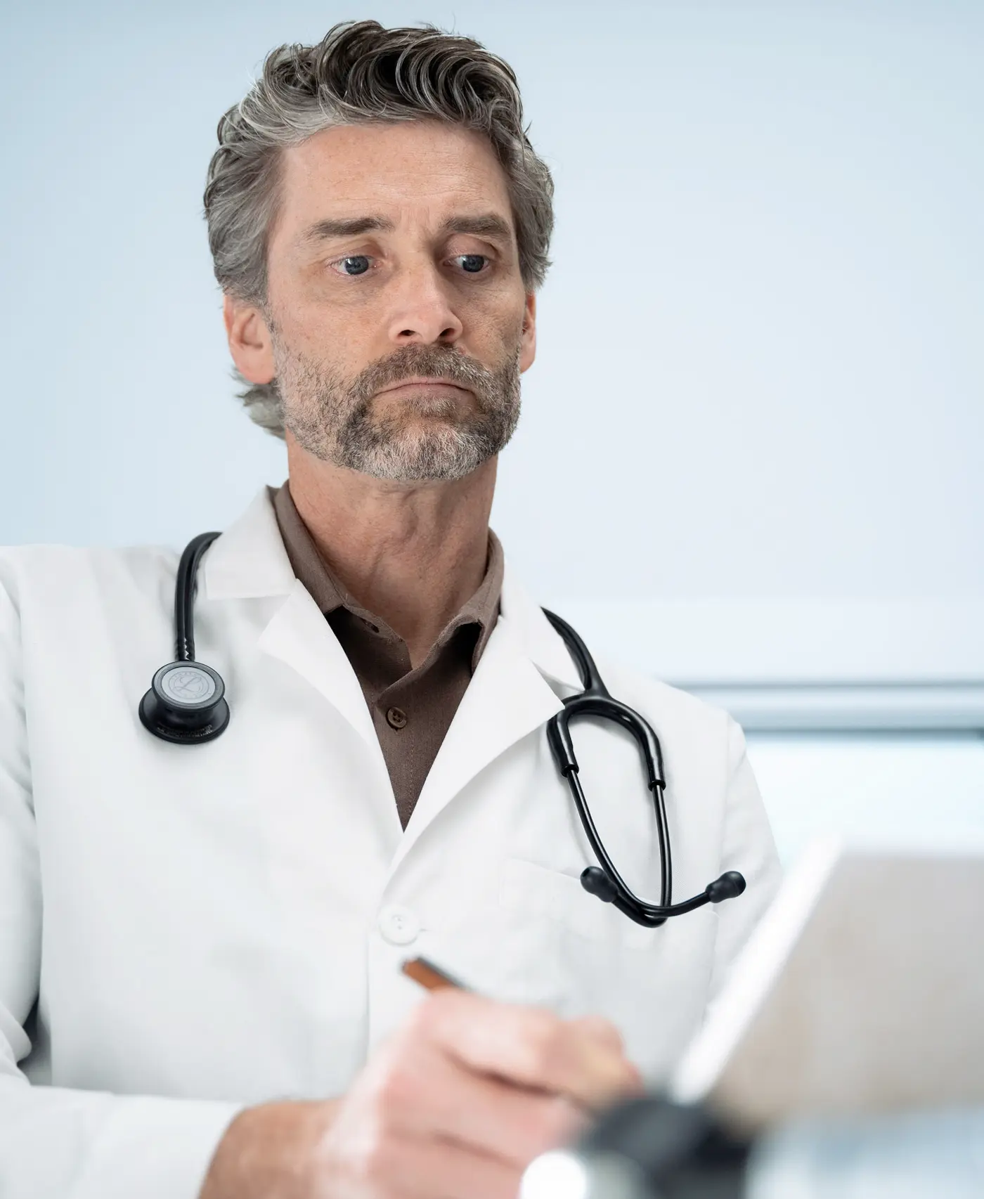 Image of a doctor writing prescriptions