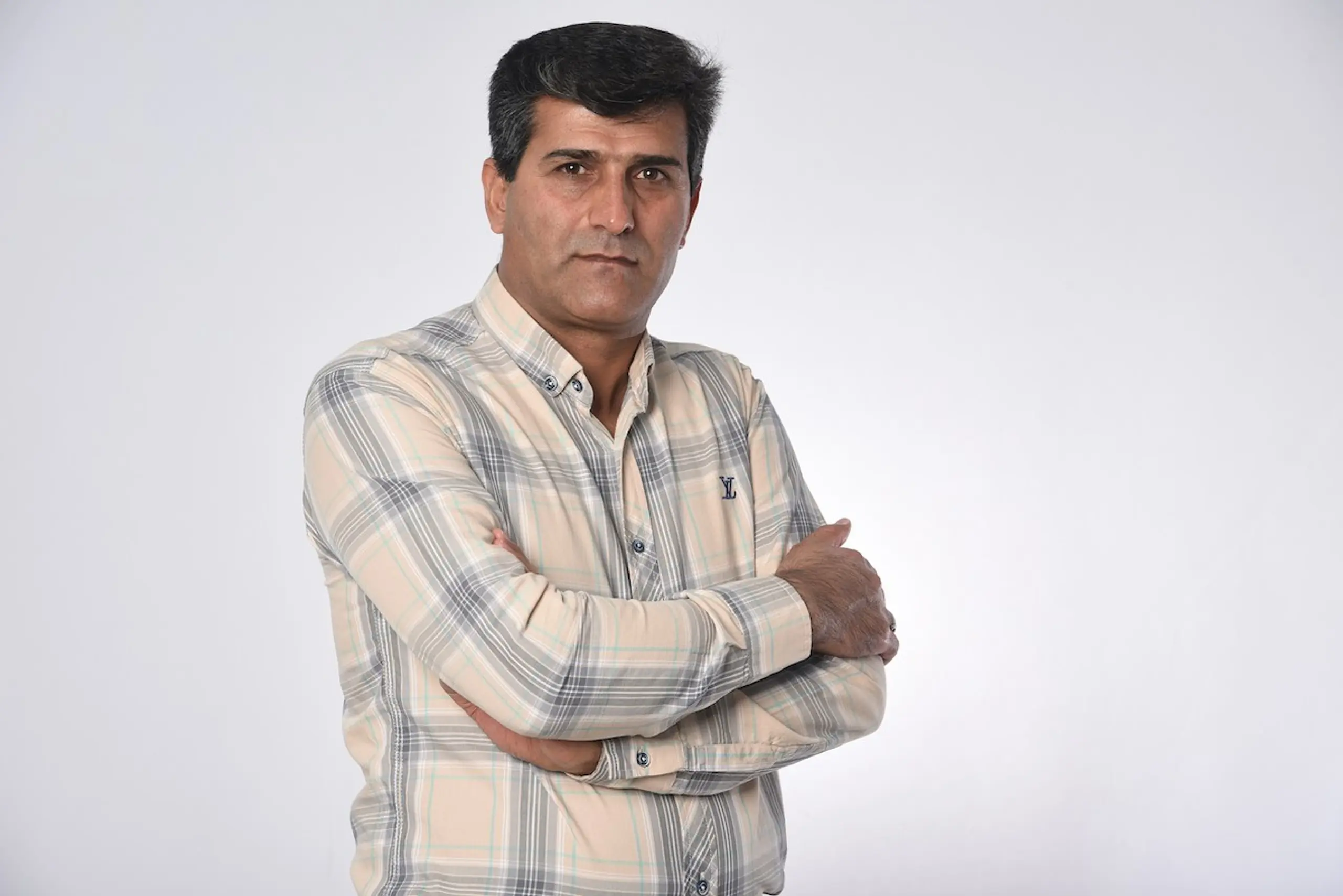 A man crossing his arms