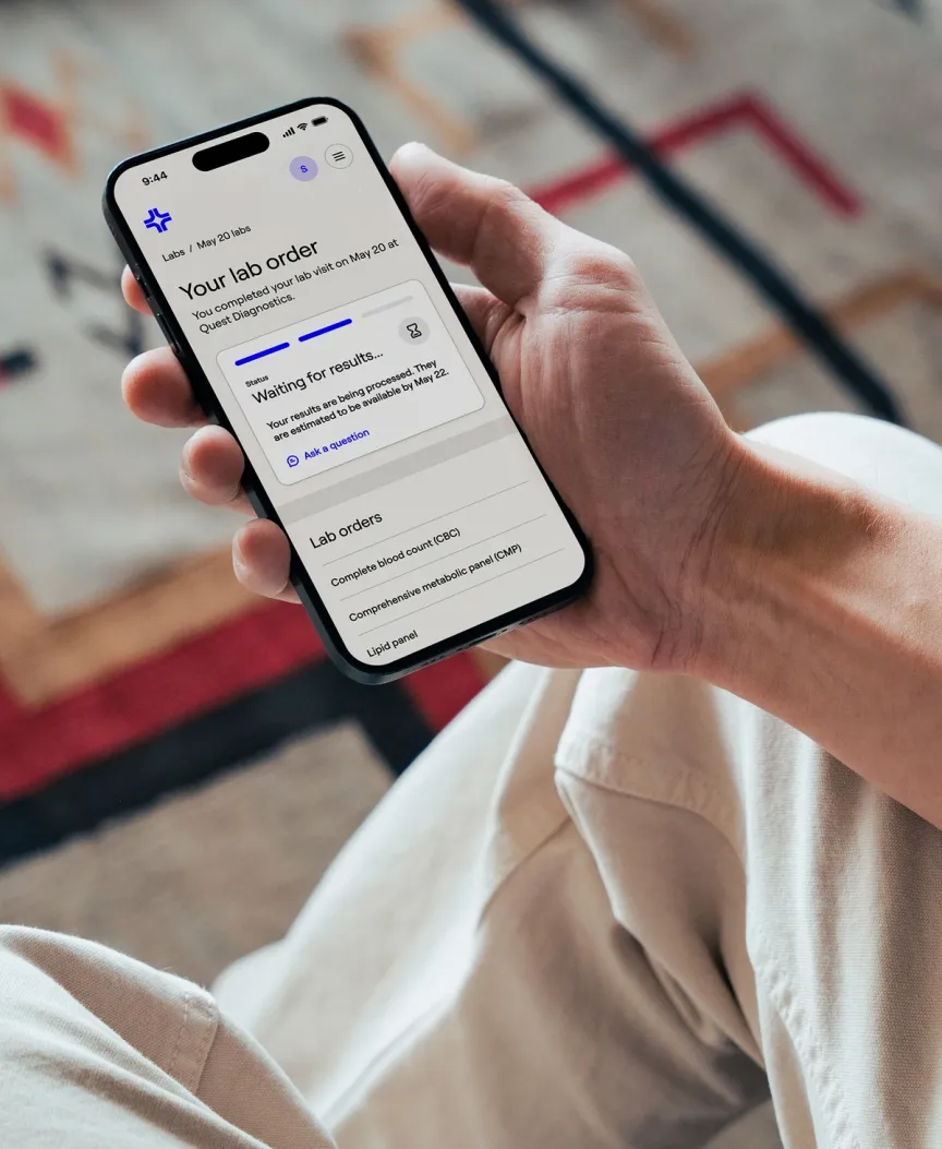 Photo of a person using the General Medicine App on a phone